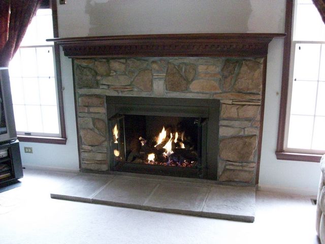 Gas Log Conversion, New Hearth Stones, Refinished Glass Doors, Cultured Stone, Reconditioned Mantel