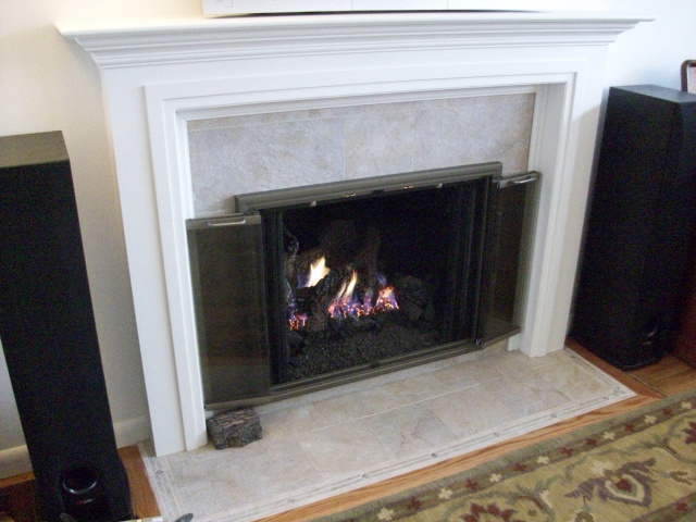 New Wall, Custom Painted Mantel, New Stone Tile Hearth and Surround, Clearview Champagne Nickle Full Swing Doors and Oak Floor Moulding