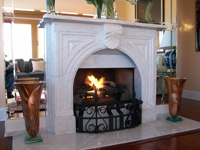 New Carrera Marble Surround and Hearth, Custom Black Iron Fender, New  Oak Floor Moulding, New Mirror Scape